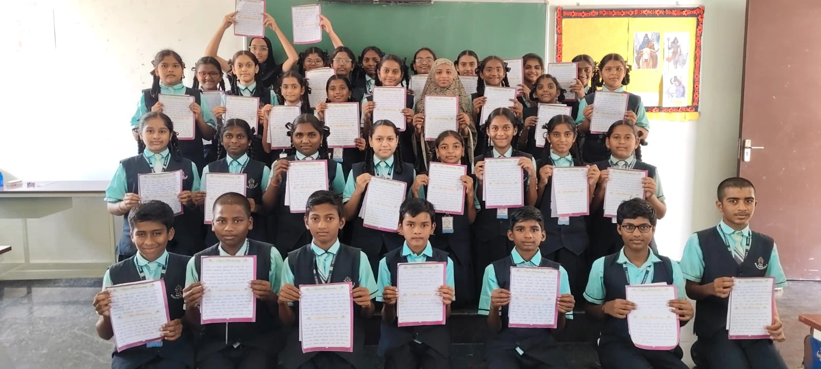Students proudly presenting their written work
